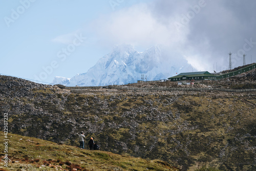 China - Septemper 30, 2020: A military facility in Tibet and a snow-capped mountain in the distance photo