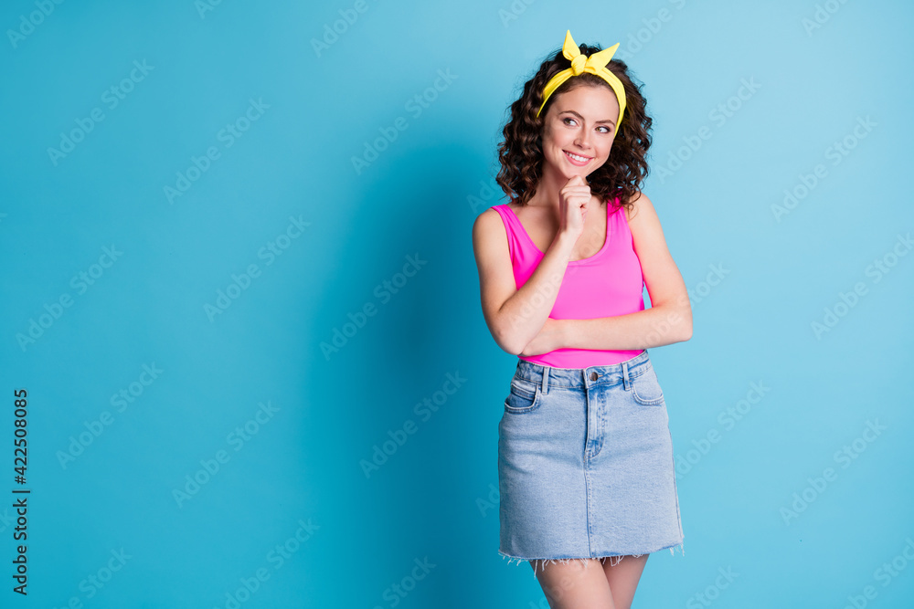 Photo of cute shiny young lady wear pink singlet arm chin smiling looking empty space isolated blue color background