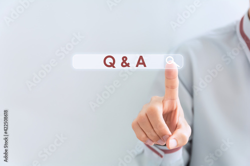 Text sign showing Q And A. Conceptual photo defined as questions being asked and answers Businessman in the blue suite with lap top pointing with finger.