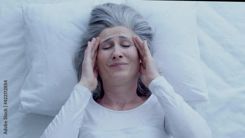 Attractive woman suffering from noise, feeling headache, sleepless night, stress Attractive woman suffering from noise, feeling headache, sleepless night, stress
