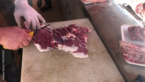 Butcher cutting beef meat, butcher cutting lamb meat in kitchen, Turkish butcher cutting lamb meat