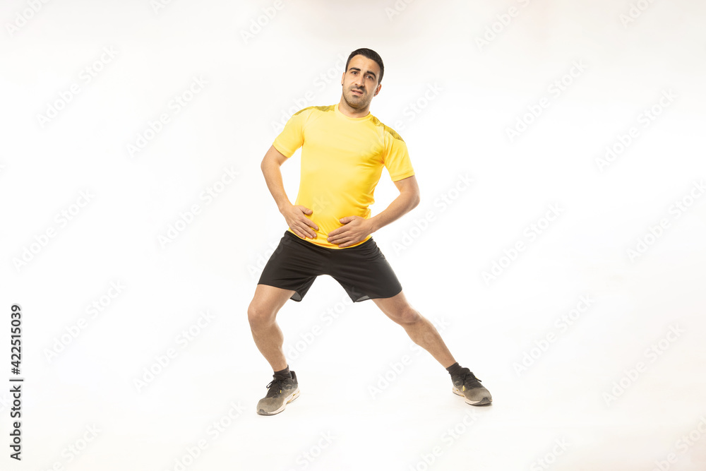athlete man stretching exercises on white background.