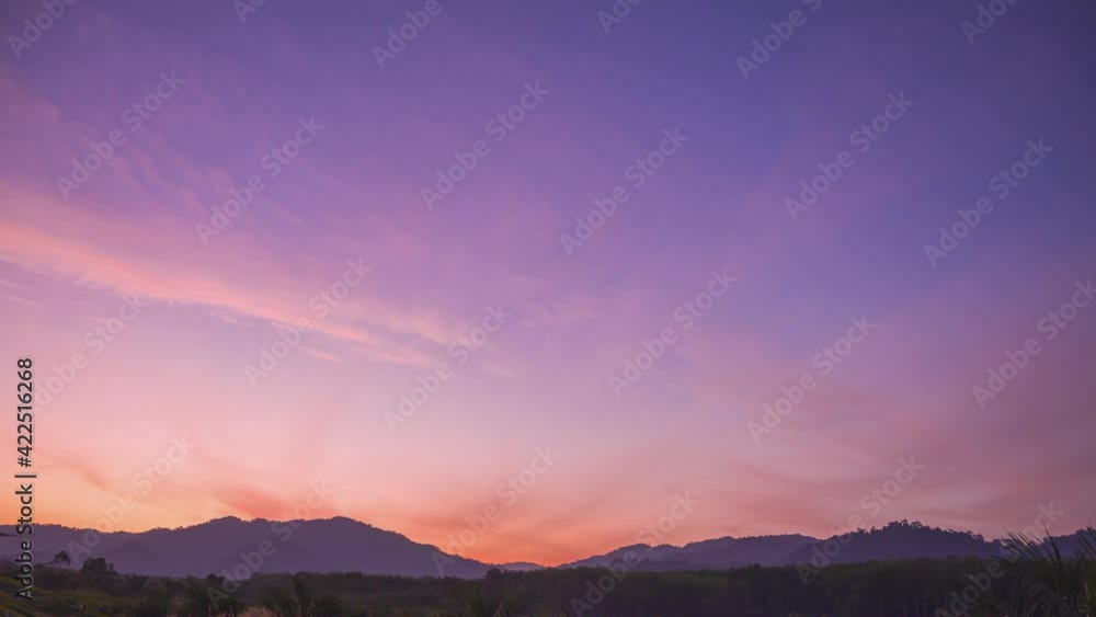 Timelapse of sunrise at the mountain, dawn firstlight beginning of the day, footage of colorful clouds sky on Easter Sunday morning, and color of weather and springtime season in nature. b roll video Timelapse of sunrise at the mountain, dawn firstlight beginning of the day, footage of colorful clouds sky on Easter Sunday morning, and color of weather and springtime season in nature. b roll video