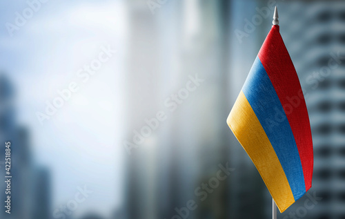 Cuadro en lienzo A small flag of Armenia on the background of a blurred background