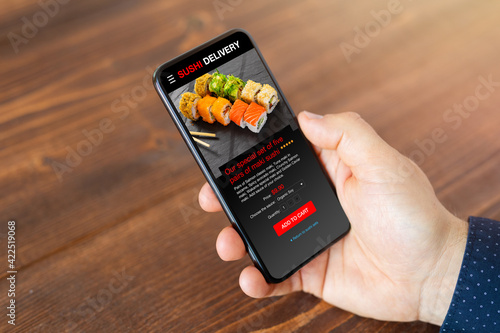 Photography Person ordering sushi on mobile phone for home delivery