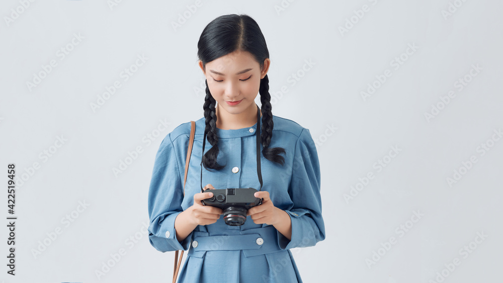 Beautiful smiling asian woman with photo camera Beautiful smiling asian woman with photo camera