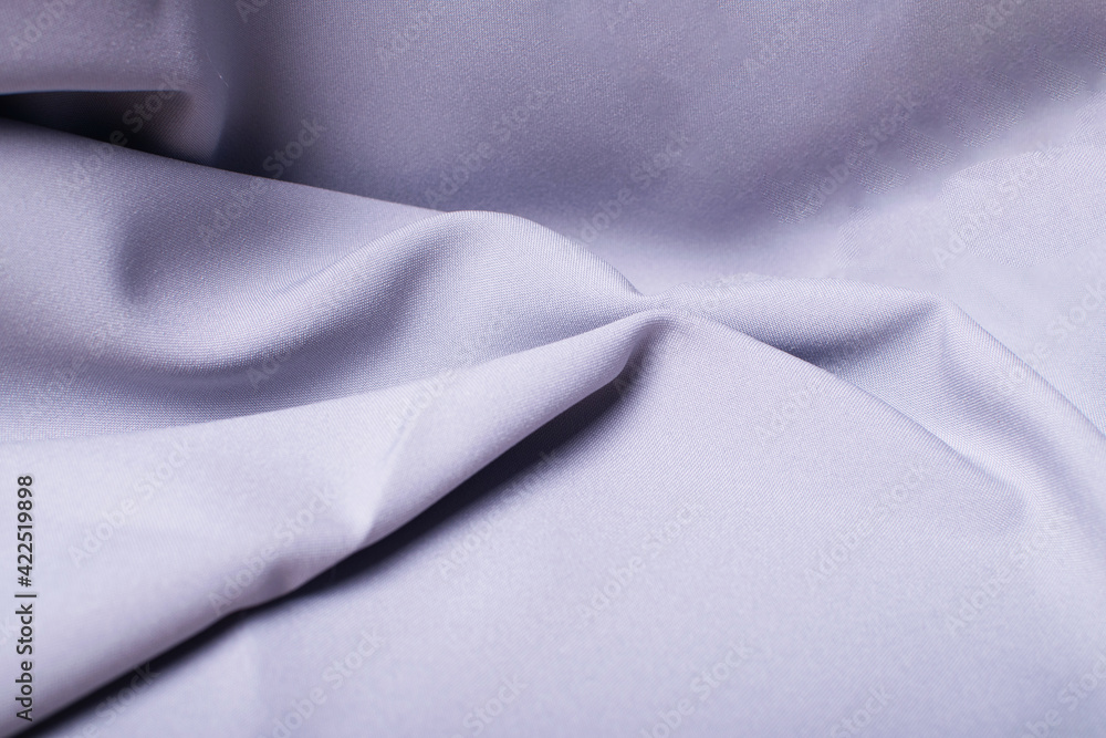 Beautiful grey silk as a background, grey abstraction. Beautiful grey silk as a background, grey abstraction.
