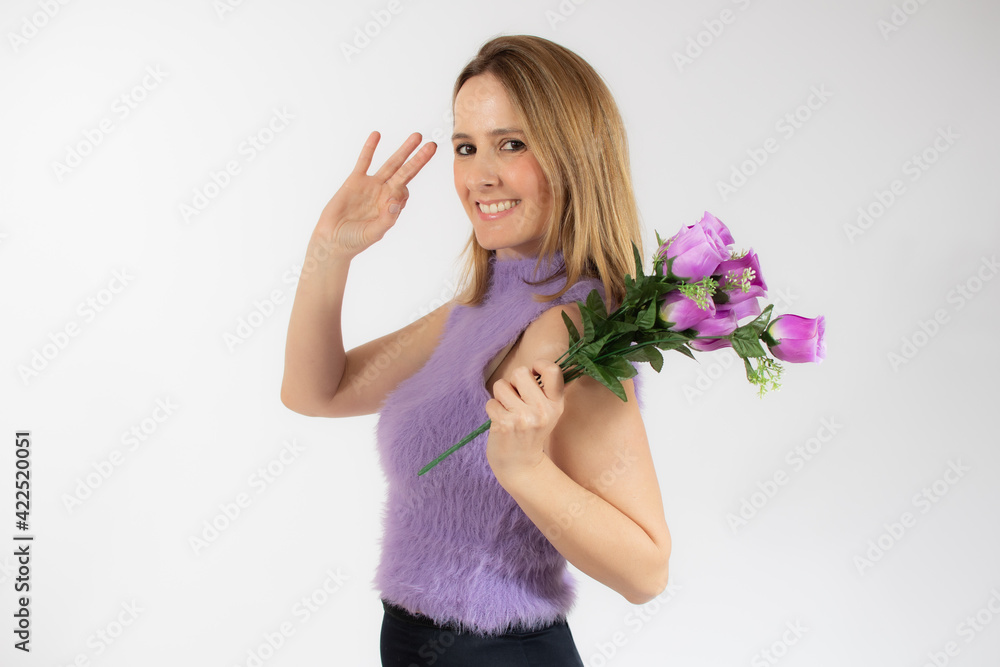 Portrait of a beautiful young woman in casual clothes holding bouquet of flowers isolated over white background Portrait of a beautiful young woman in casual clothes holding bouquet of flowers isolated over white background