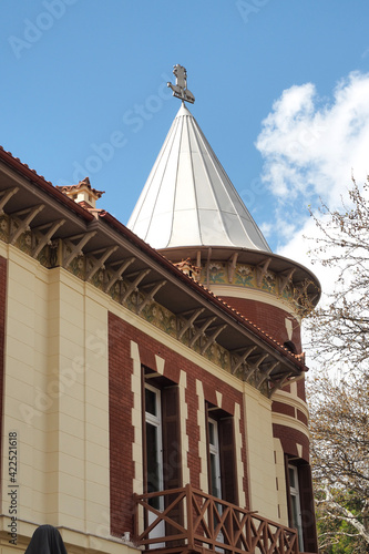 Beautiful public neoclassic tower building in Kifisia district on a blue cloudy sky, North Athens, Attica, Greece photo