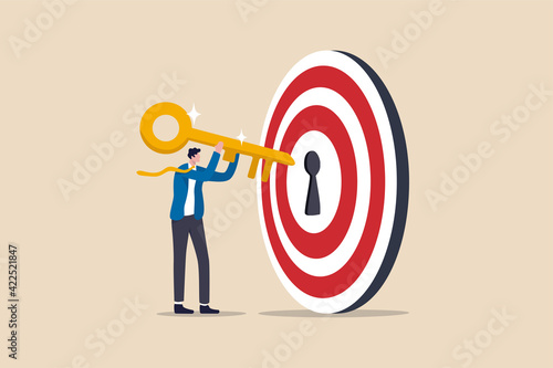 Key to success and achieve business target, KPI, career achievement or secret for success in work concept, businessman putting golden key into bullseye target key hold to unlock business success.