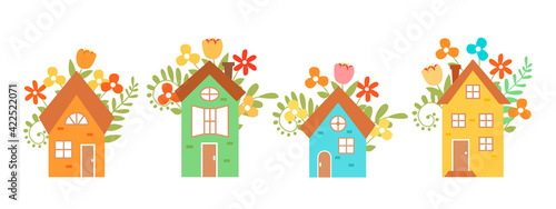 Set of cute vector houses isolated on white background.  Hand-drawn houses surrounded by flowers. Vector illustration for design postcards. 