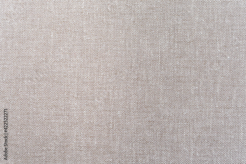 Flax fabric texture. Large seamless fabric texture background. Linen canvas background textile texture. Warm grey or beige artificial rough cloth texture