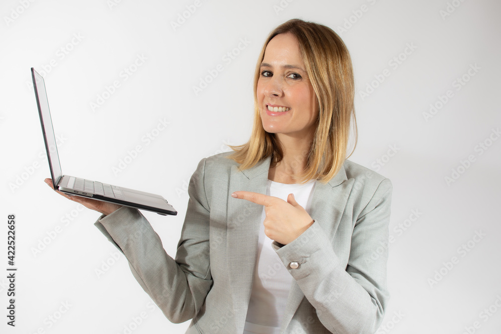 Business young woman holding laptop computer over white background Business young woman holding laptop computer over white background