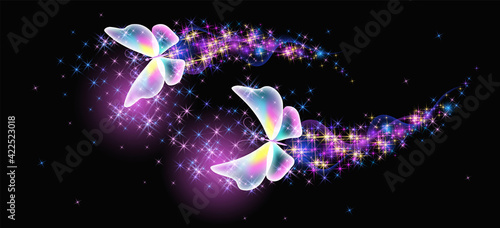 Flying delightful butterflies with sparkle and blazing trail flying in night sky among shiny glowing stars in cosmic space. Animal protection day concept.