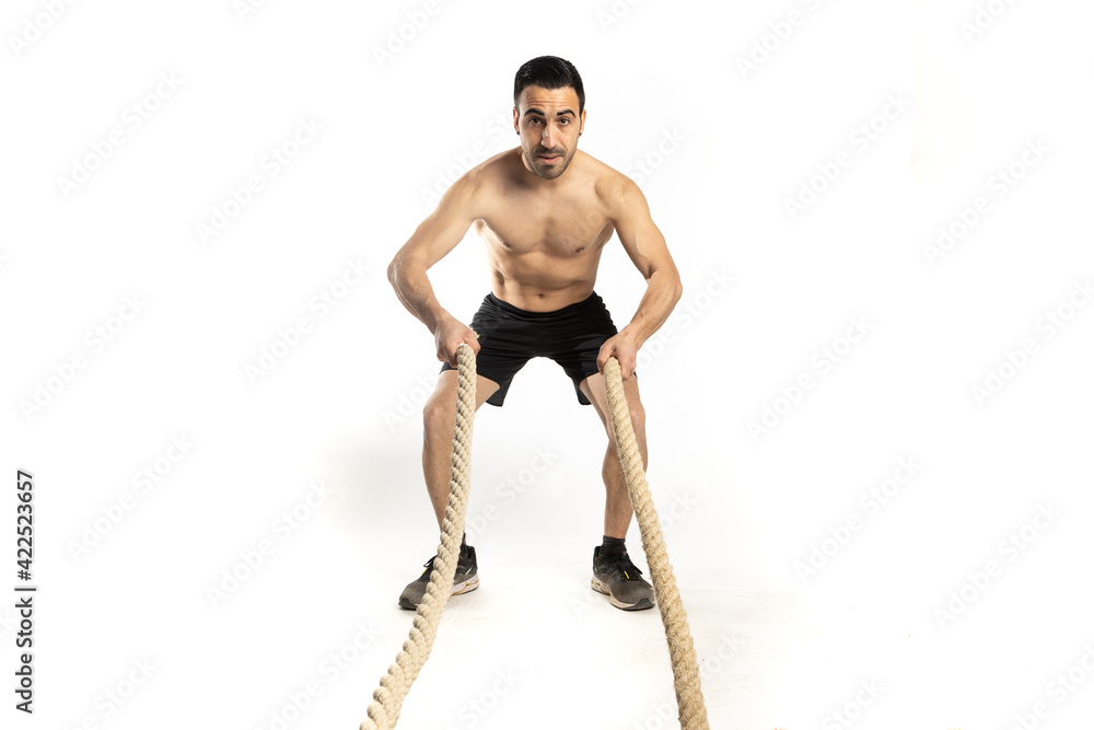 athlete man training with gym ropes on white background athlete man training with gym ropes on white background