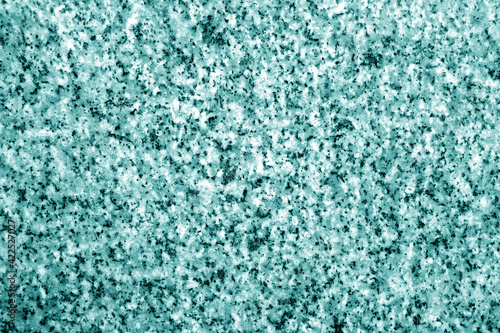 Granite surface as background in cyan tone.