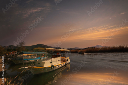 (Dalyan - Mugla - Turkey 05 February .2021) Cruise boats on the river between Köycagiz Lake and Iztuzu beach in Dalyan.