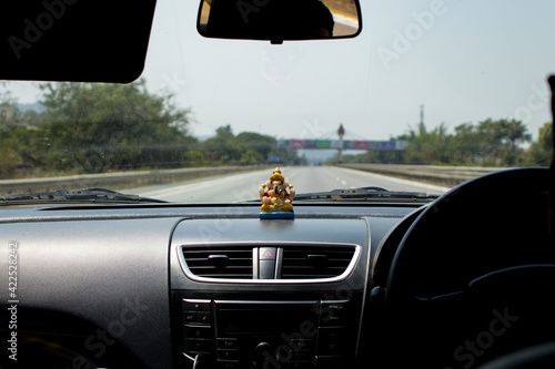 car dashboard with empty expressway look through car windshield