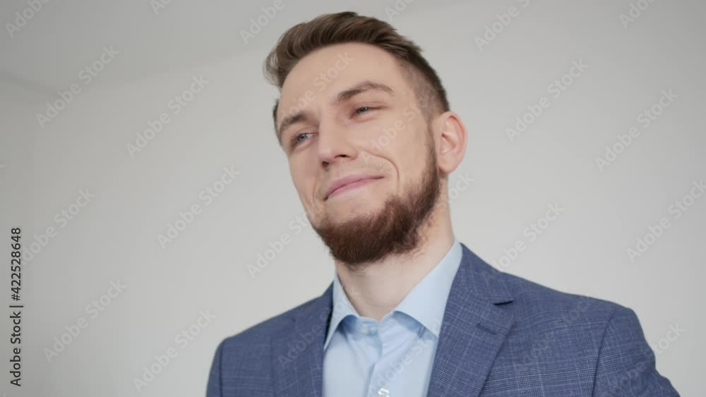 The guy looks at his wristwatch and smiles. Close-up shooting The guy looks at his wristwatch and smiles. Close-up shooting