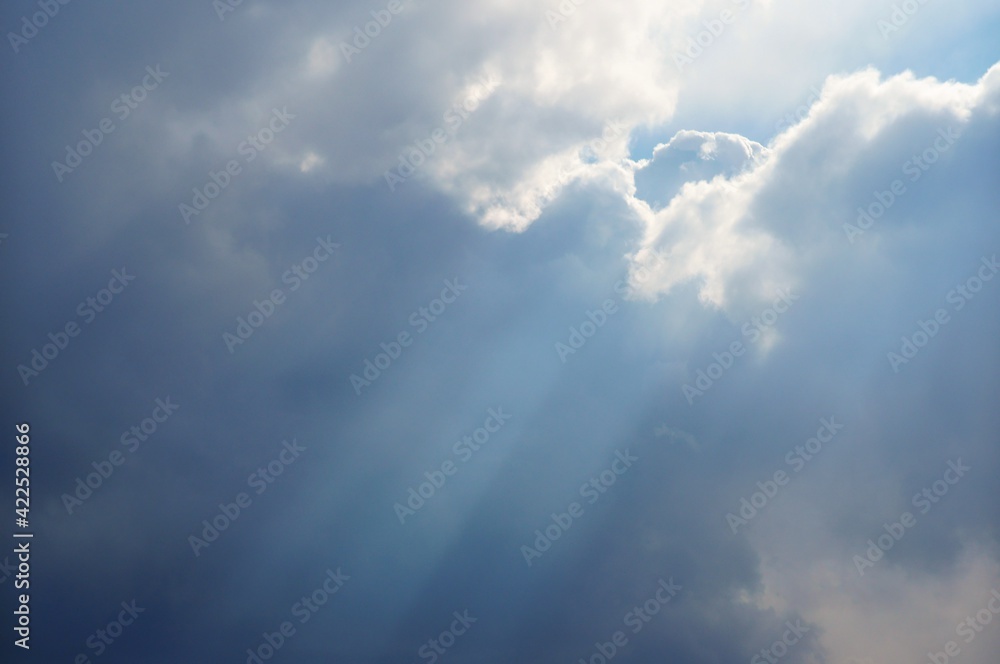 The sun's rays coming through the clouds. The sun's rays coming through the clouds.