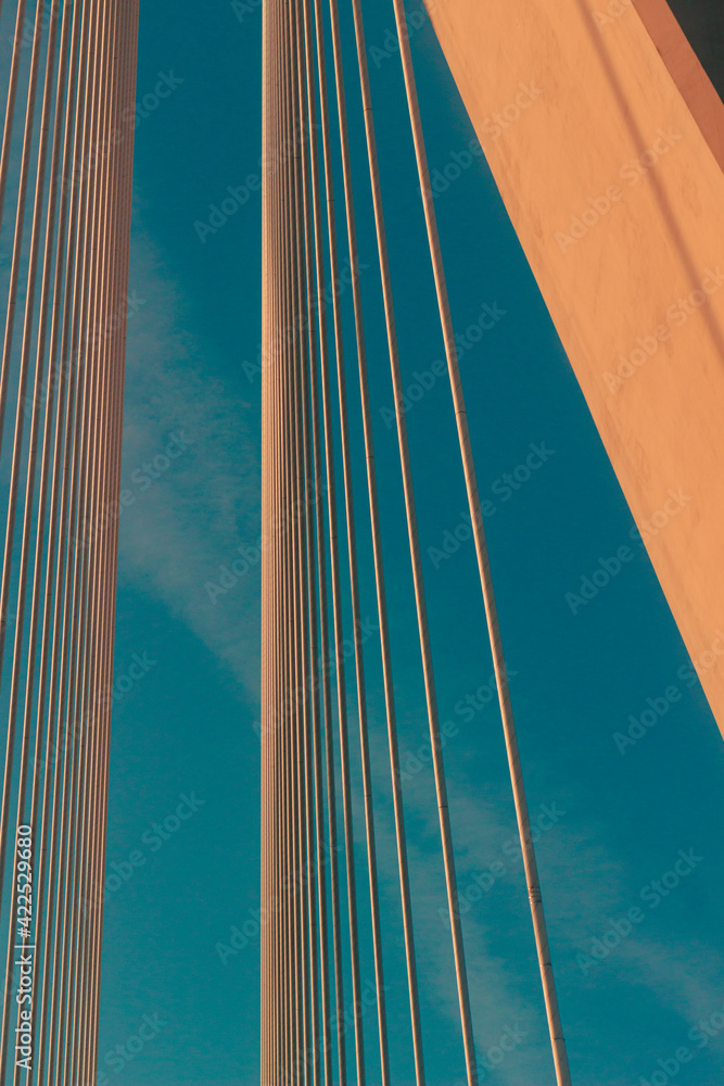 view from below on the part of the bridge with the sky in background view from below on the part of the bridge with the sky in background