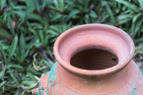 Pot plant made of clay. Placed in the garden. photo