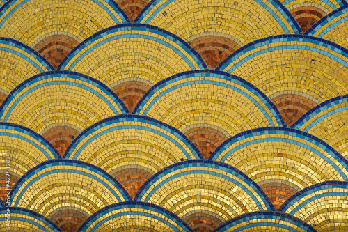 Golden fish scale like mosaic pattern in Art Nouveau style on a building