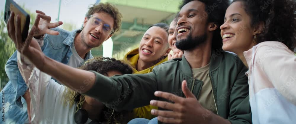 Video of group of young people doing selfie outdoors. Shot with RED helium camera in 8K. Video of group of young people doing selfie outdoors. Shot with RED helium camera in 8K.