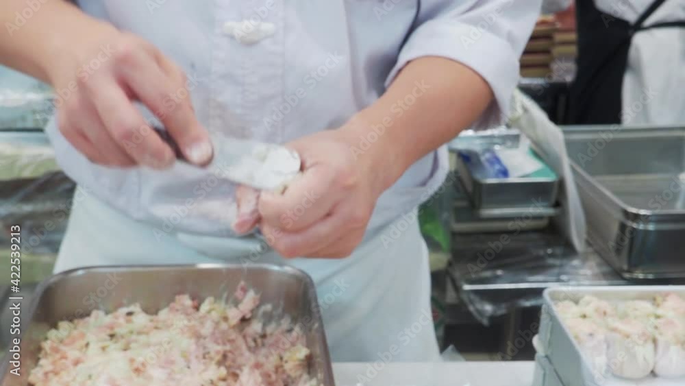Making Dim Sum. Chef preparing Dim sum dumplings. Kneading the dough