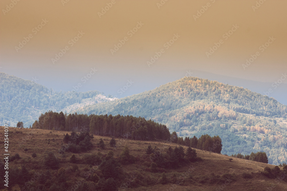 sunset light in autumn landscape with hills and mountains sunset light in autumn landscape with hills and mountains