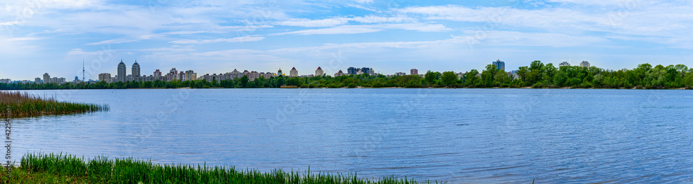 Panoramic landscape view of Dnipro river and its Right bank of Obolon district at early spring, Kyiv 