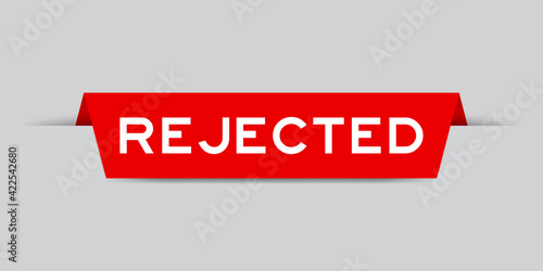 Red color inserted label with word rejected on gray background