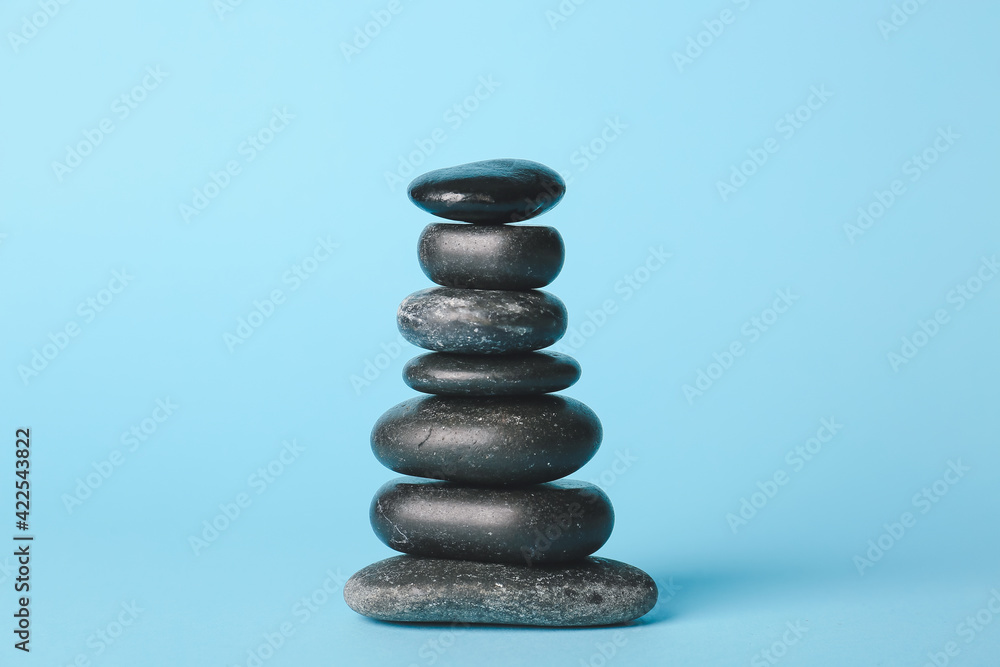 Stack of spa stones on color background Stack of spa stones on color background