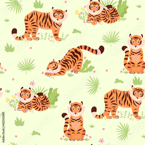Seamless pattern with cute tigers and plants. Vector graphics.