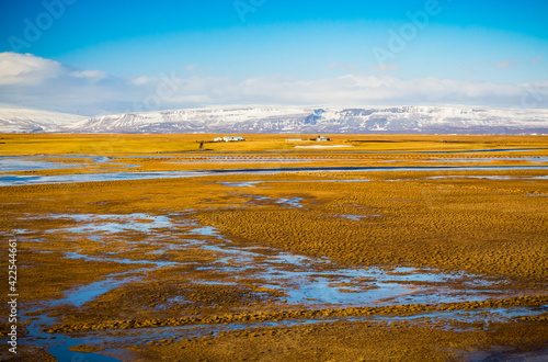 Large ponds and puddles appear on landscape due to melting snow in February. photo