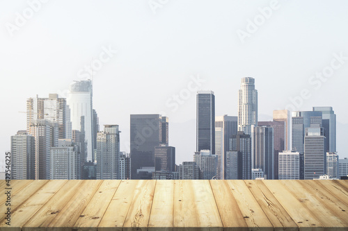 Wooden tabletop with beautiful Los Angeles buildings on background  mock up