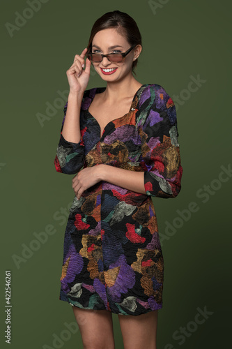 smiling girl in colorful dress with sunglasses