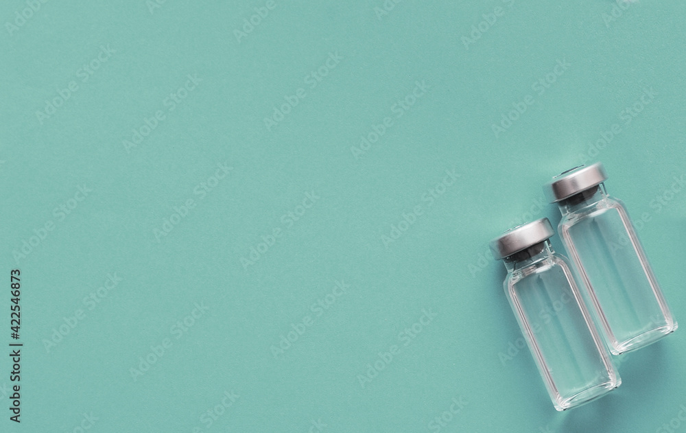 Vaccination concept. Syringe, vaccine, on blue background Vaccination concept. Syringe, vaccine, on blue background