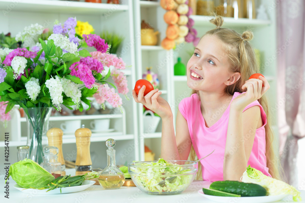 Cute girl preparing delicious fresh salad Cute girl preparing delicious fresh salad