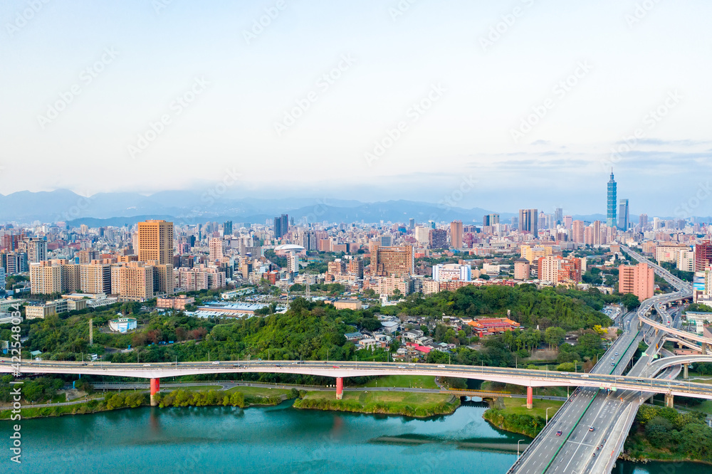 Obraz premium Taipei City Aerial View - Asia business concept image, panoramic modern cityscape building bird’s eye view under sunrise and morning blue bright sky, shot in Taipei, Taiwan