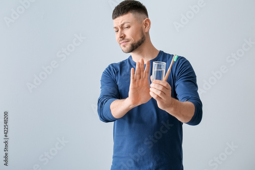 Man refusing to brush teeth...
