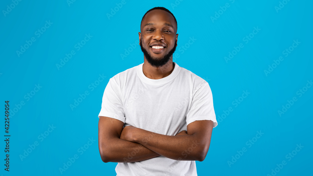 Fototapeta premium Portrait Of Happy African American Guy Over Blue Background, Panorama