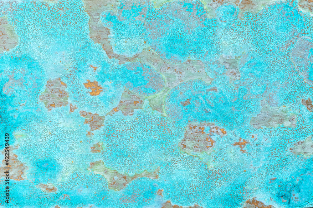 Background of cracked texture of blue plaster with brown rusty iron spots. Vintage old surface background