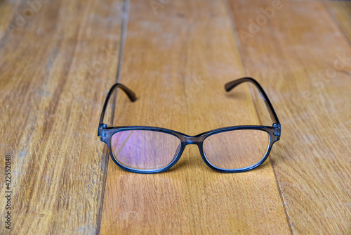 Clear eyeglasses, Glasses transparent grey Frame vintage style on wood background