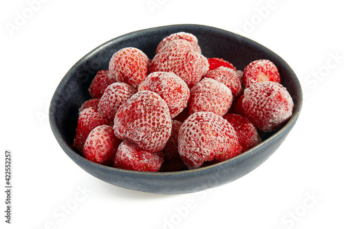 Frozen strawberries isolated on white background. Berries are being preserved for winter.