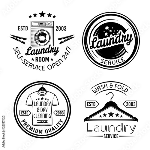 Laundry room and dry cleaning service set of four vector monochrome emblems, labels, badges isolated on white background