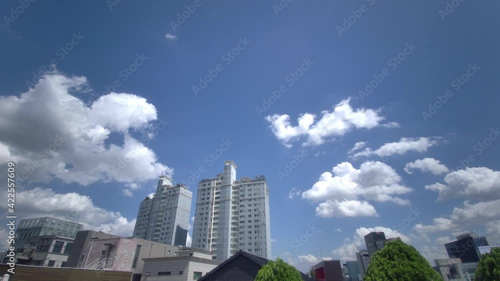 The view of Gangnam city from the rooftop of Seoul building, the blue sky and clouds The view of Gangnam city from the rooftop of Seoul building, the blue sky and clouds