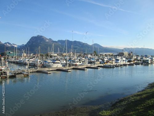 Valdez Dock and Harbor Valdez, Alaska, with Boats of the Fishing Fleet Reflected in the Glassy Water