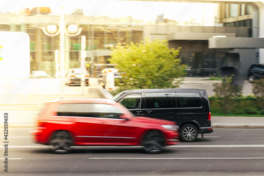 city traffic , red and black car
