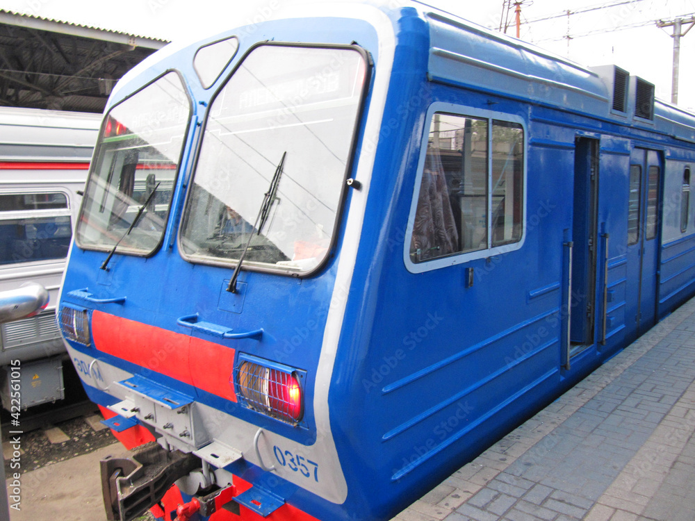 Conventional line (blue) stopping at a train station in Russia, Moscow, Russia